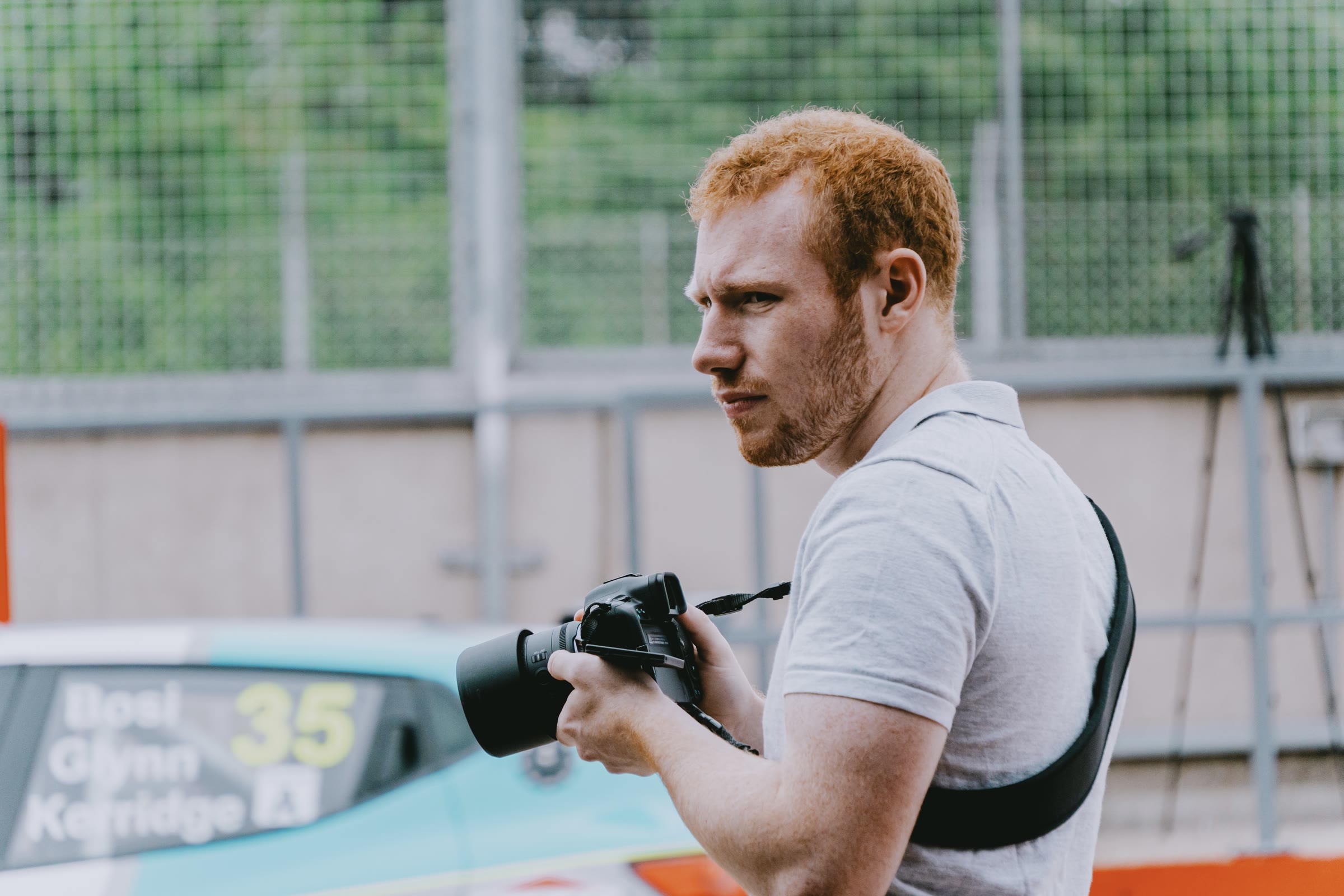 Joseph Carey with a camera, trackside