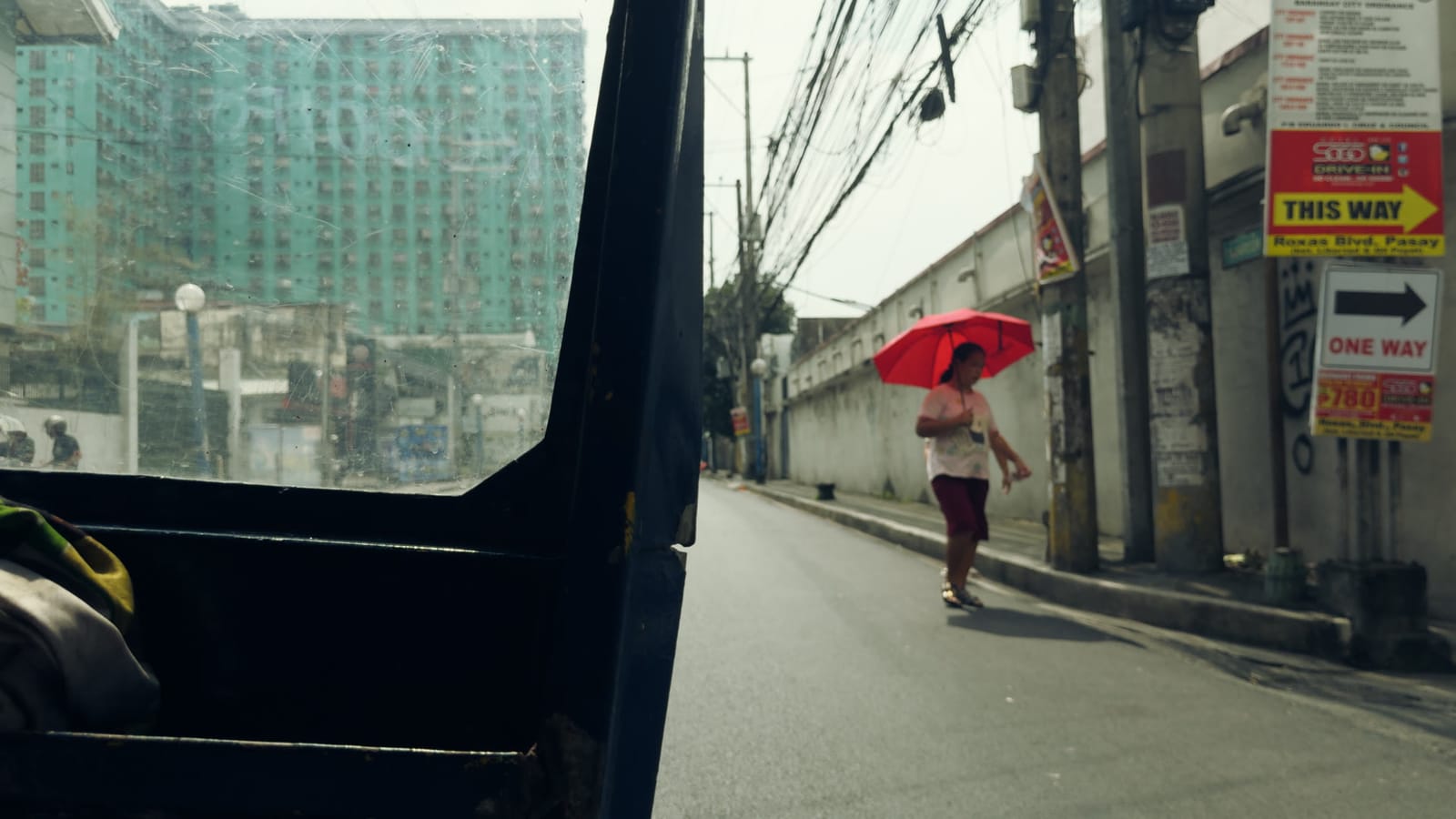 Burn, applied to log footage of a street in Manila