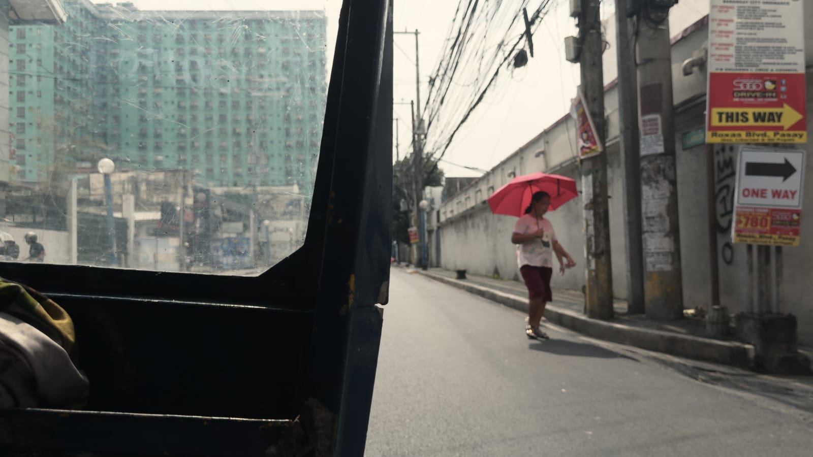 Burning Days, applied to log footage of a street in Manila