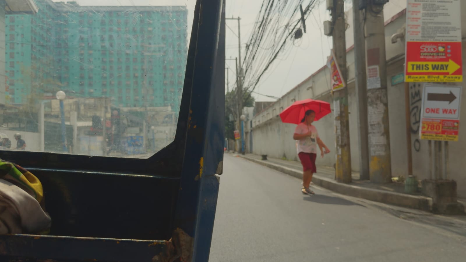 Candy (Heaven), applied to log footage of a street in Manila