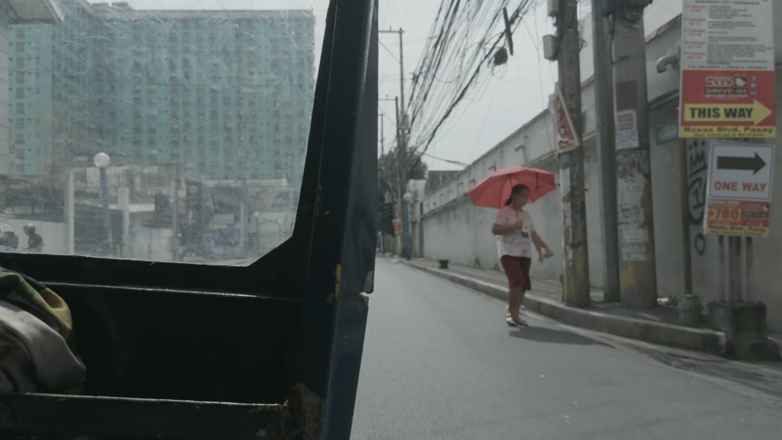 Candy (Hell), applied to log footage of a street in Manila