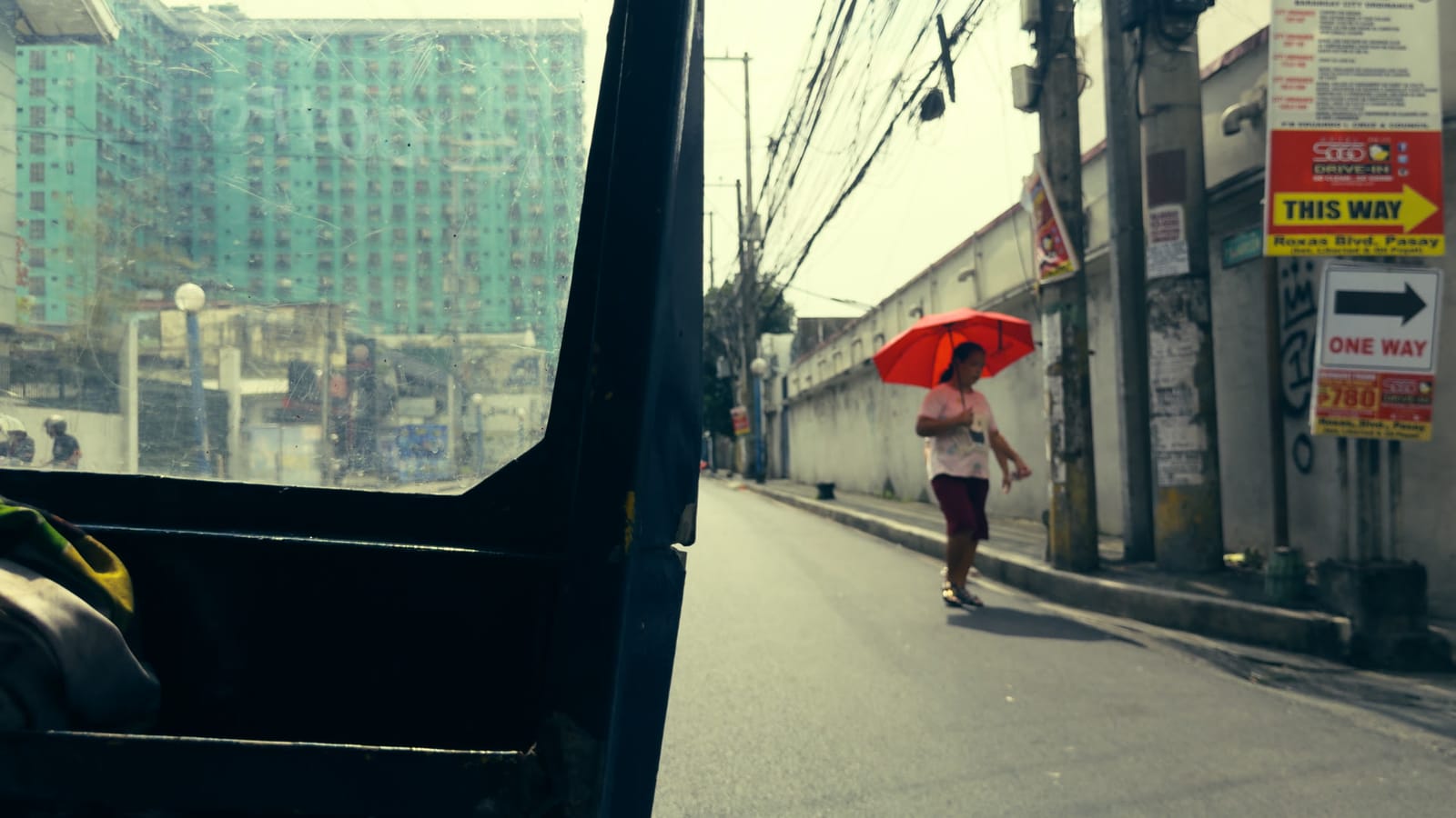 Cross Process, applied to log footage of a street in Manila