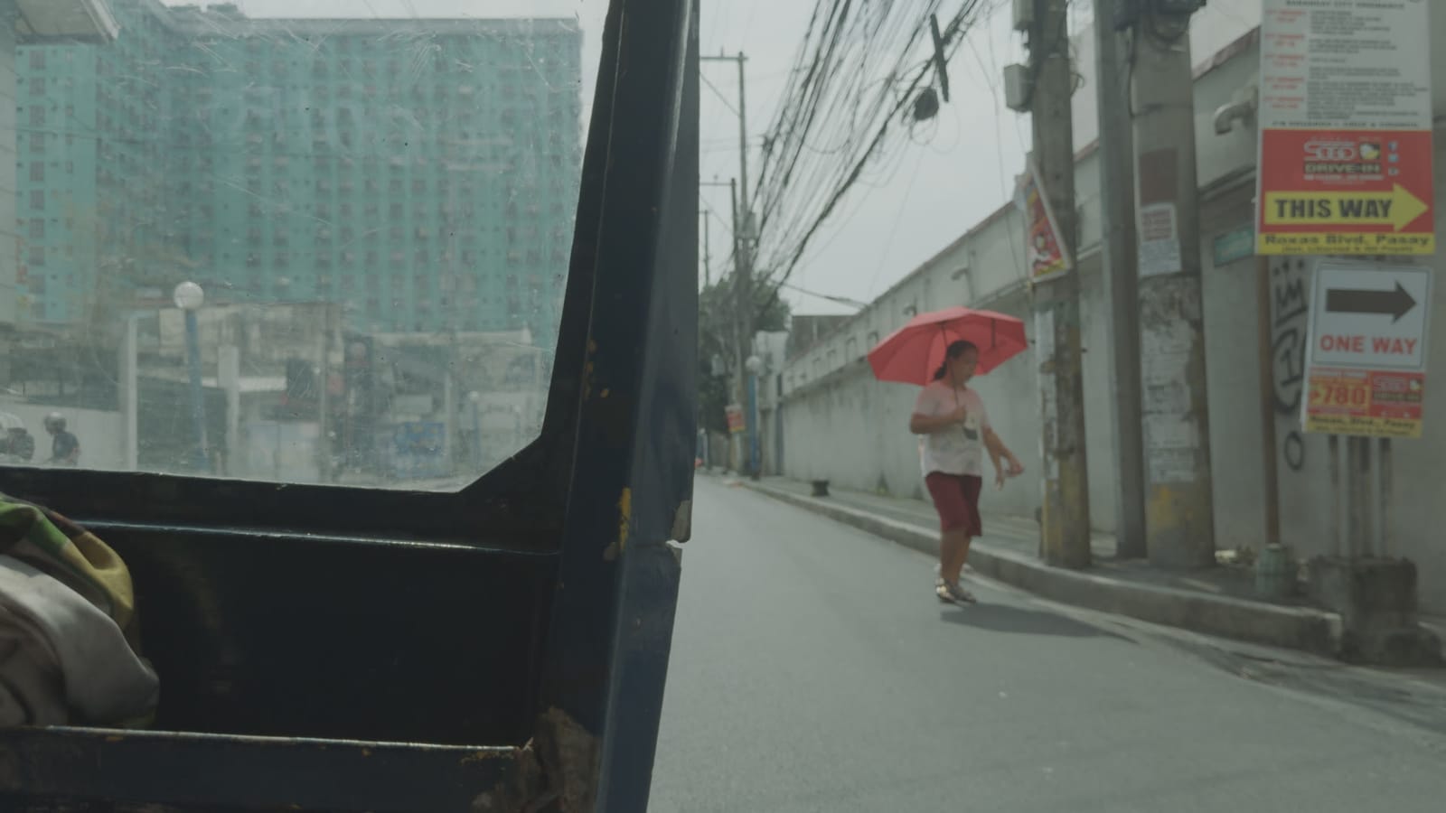 Four Letter Words, applied to log footage of a street in Manila