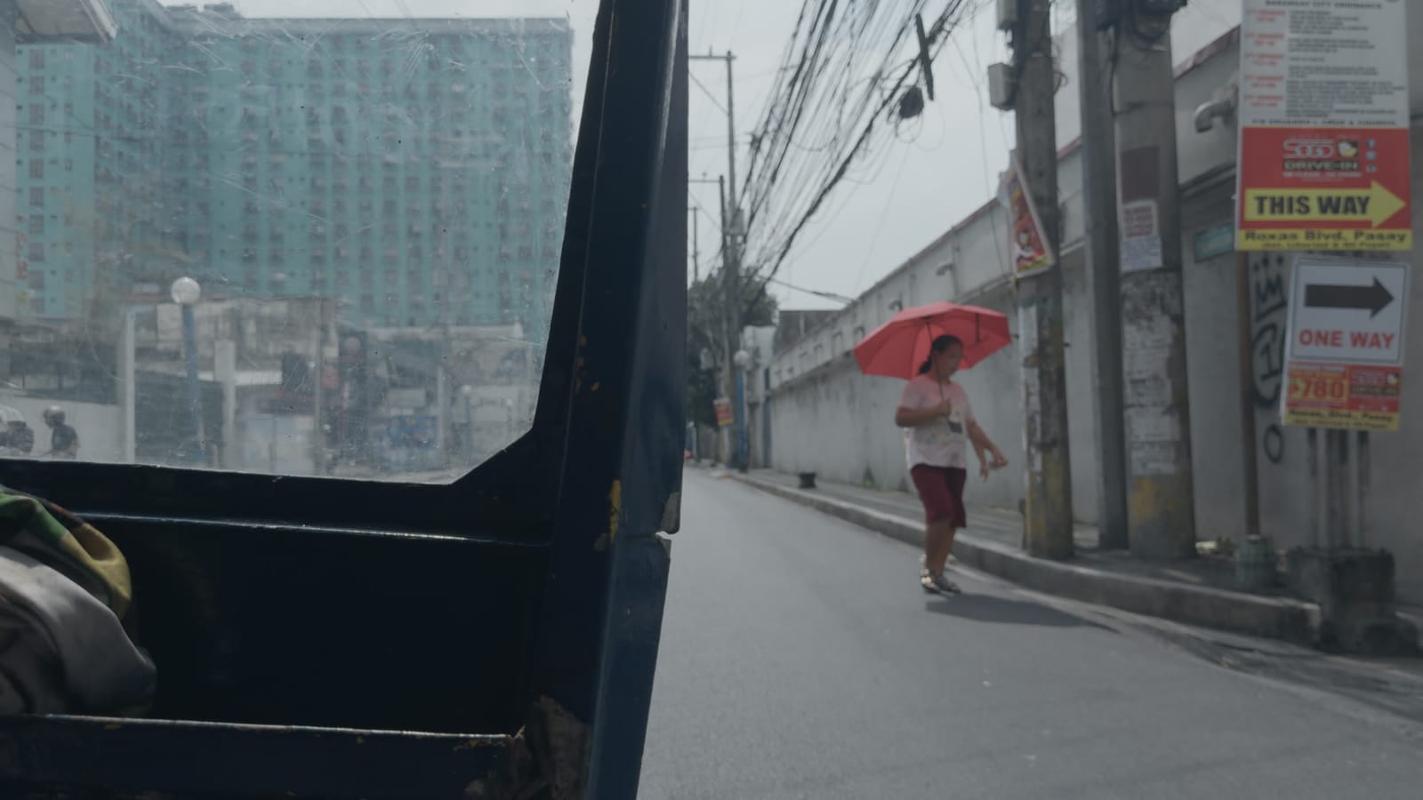 Incendies (Present), applied to log footage of a street in Manila