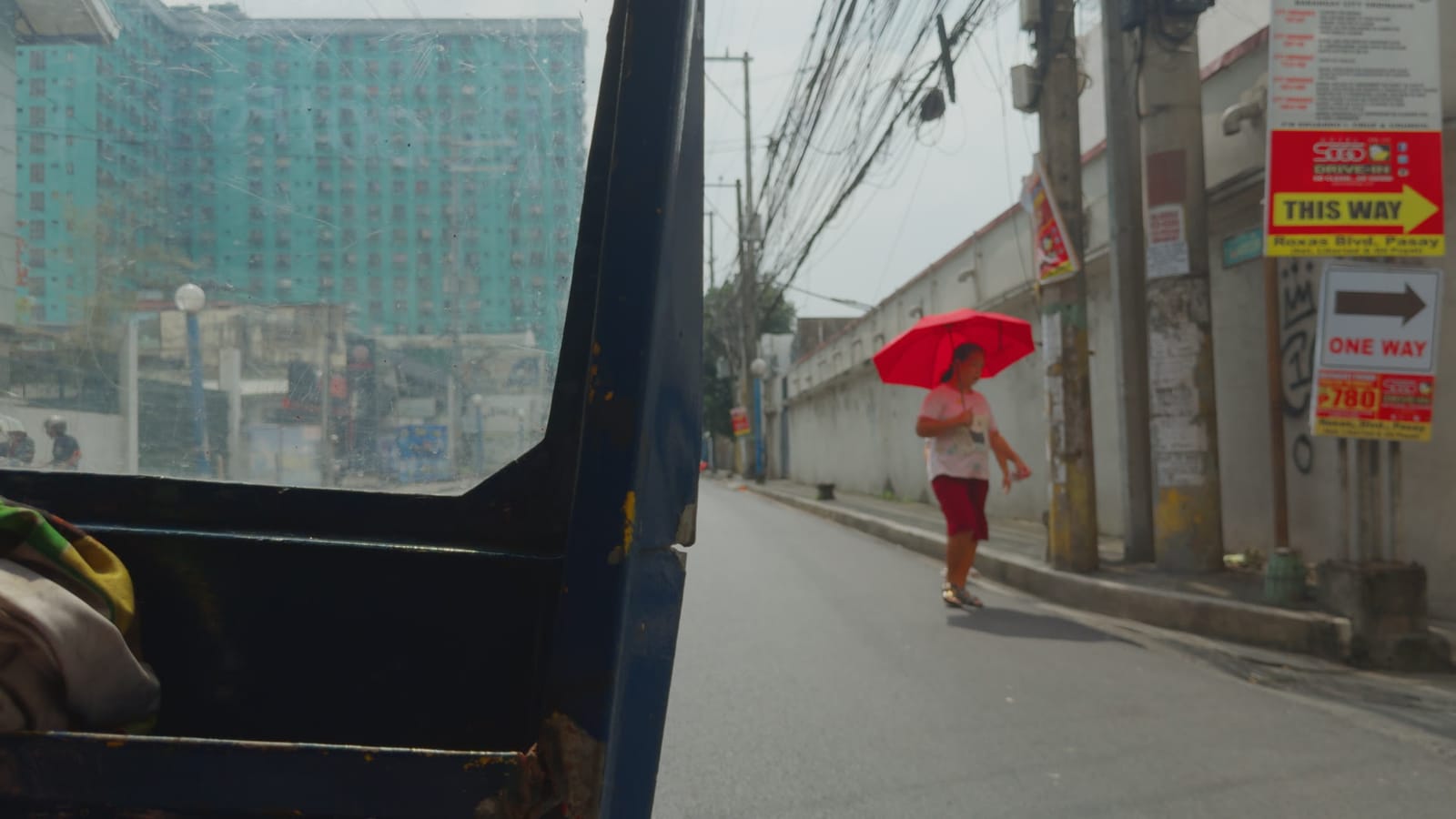 Love Lies Bleeding, applied to log footage of a street in Manila