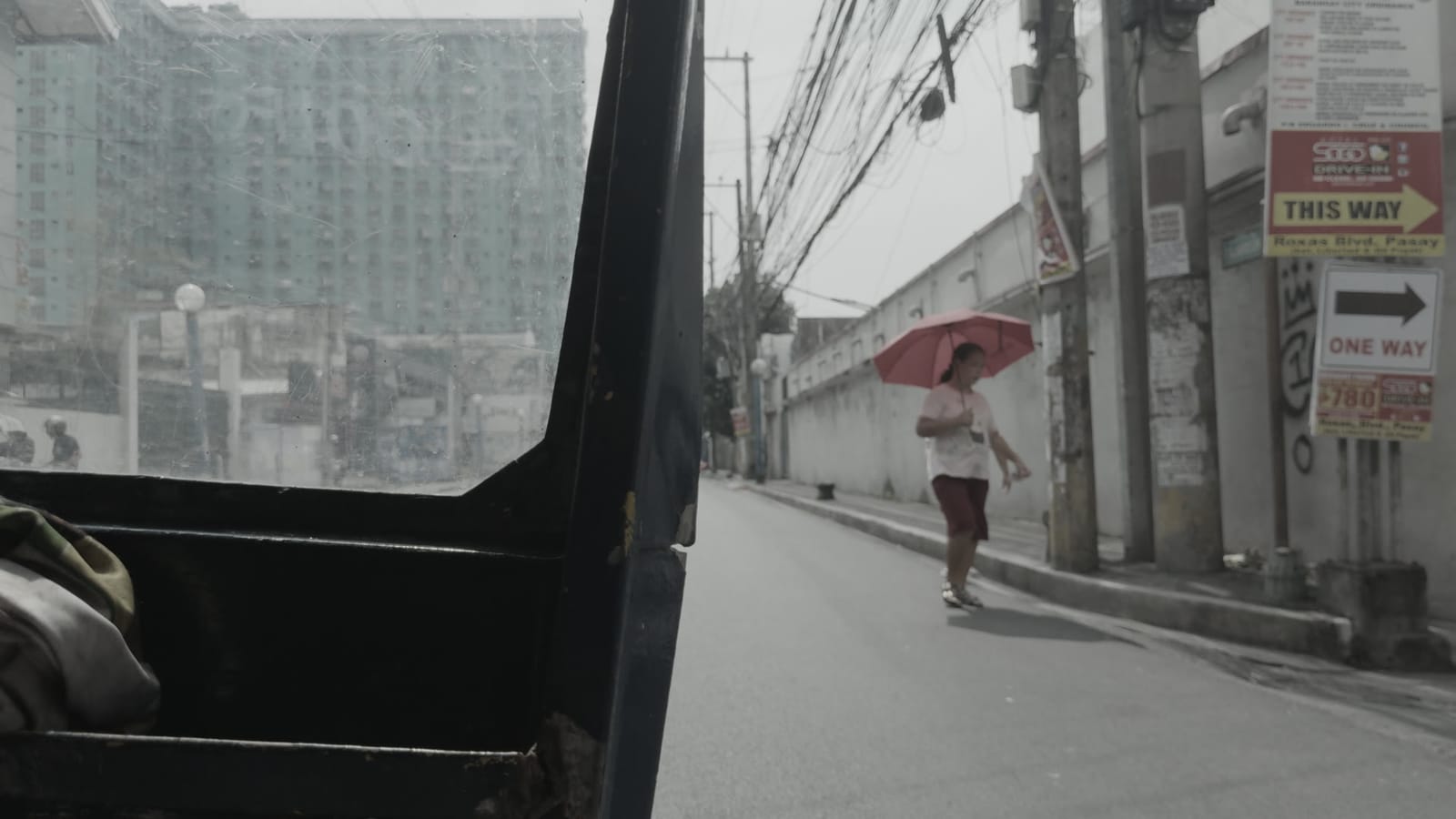 Munich (Bleach Bypass Scenes), applied to log footage of a street in Manila