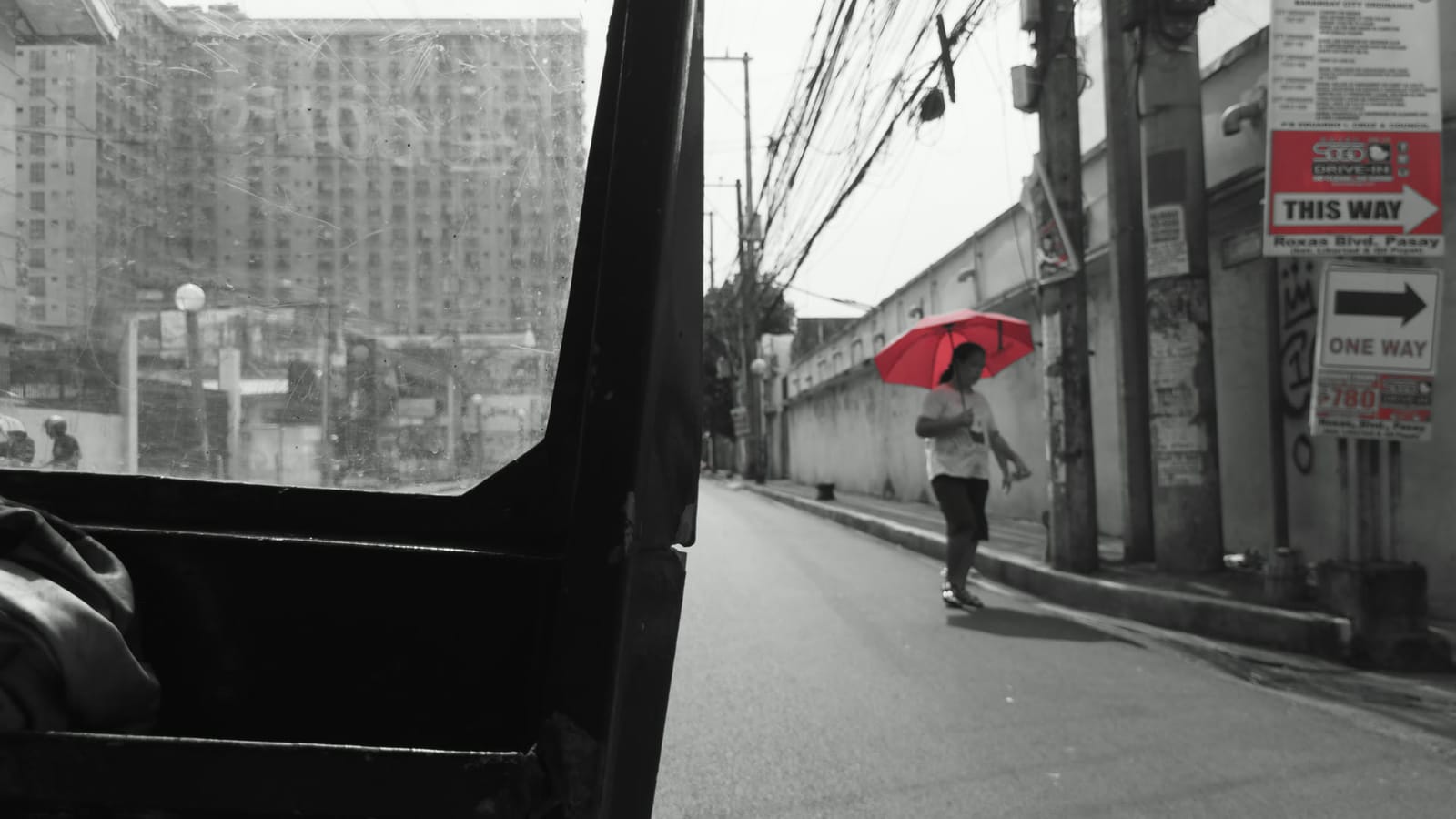 Red Accent, applied to log footage of a street in Manila