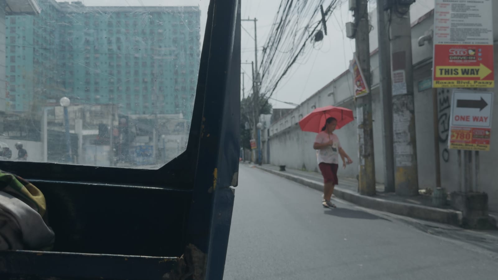 Shame, applied to log footage of a street in Manila