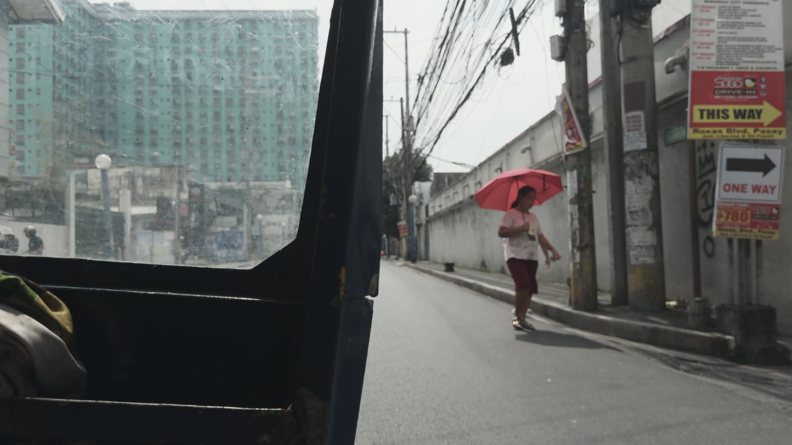 The Forgiveness of Blood, applied to log footage of a street in Manila