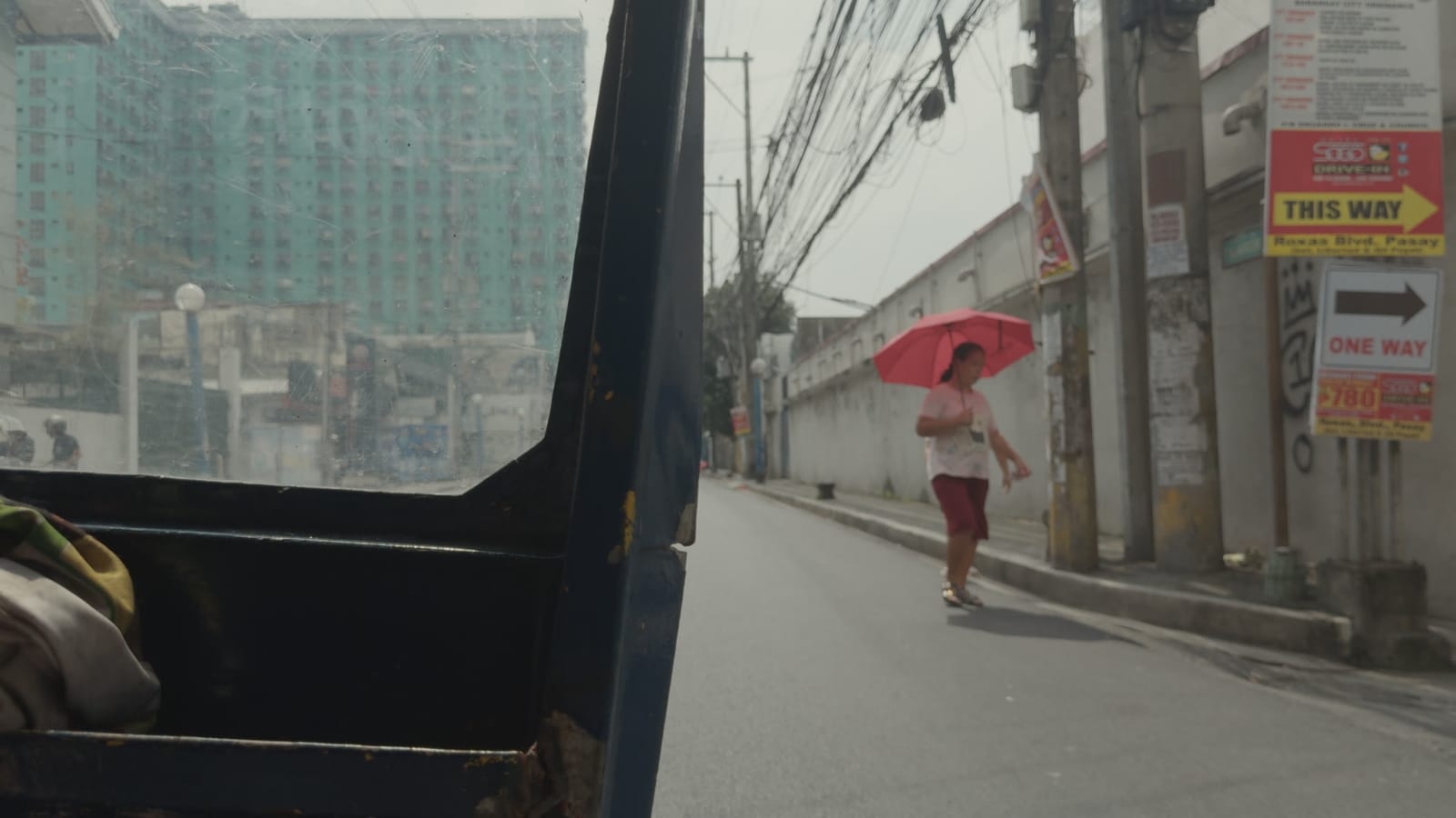 The Holdovers: Clean 1970 Print, applied to log footage of a street in Manila