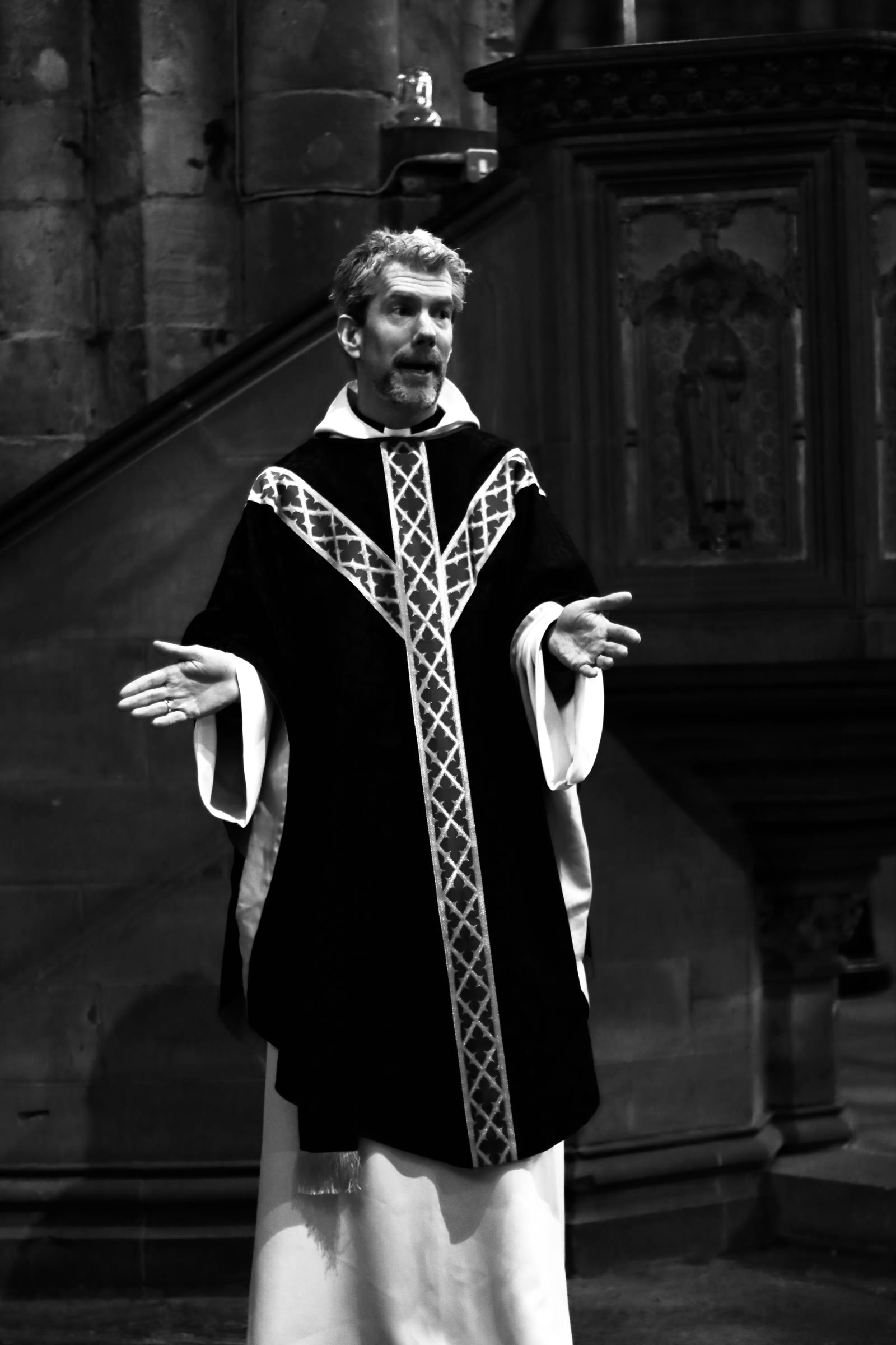 Portraits: Arms open before the pulpit