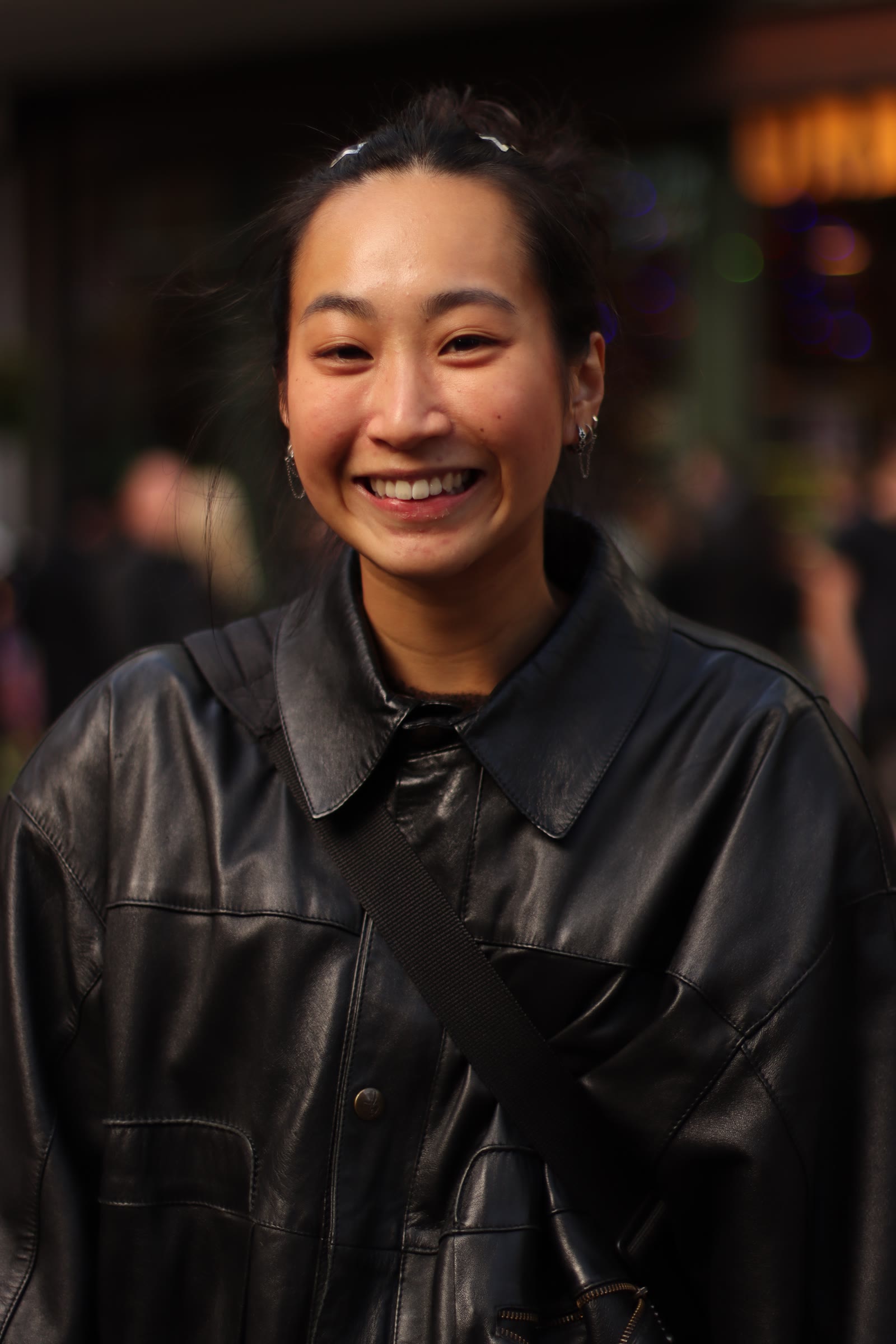 Strangers in the city: Leather jacket and a big smile