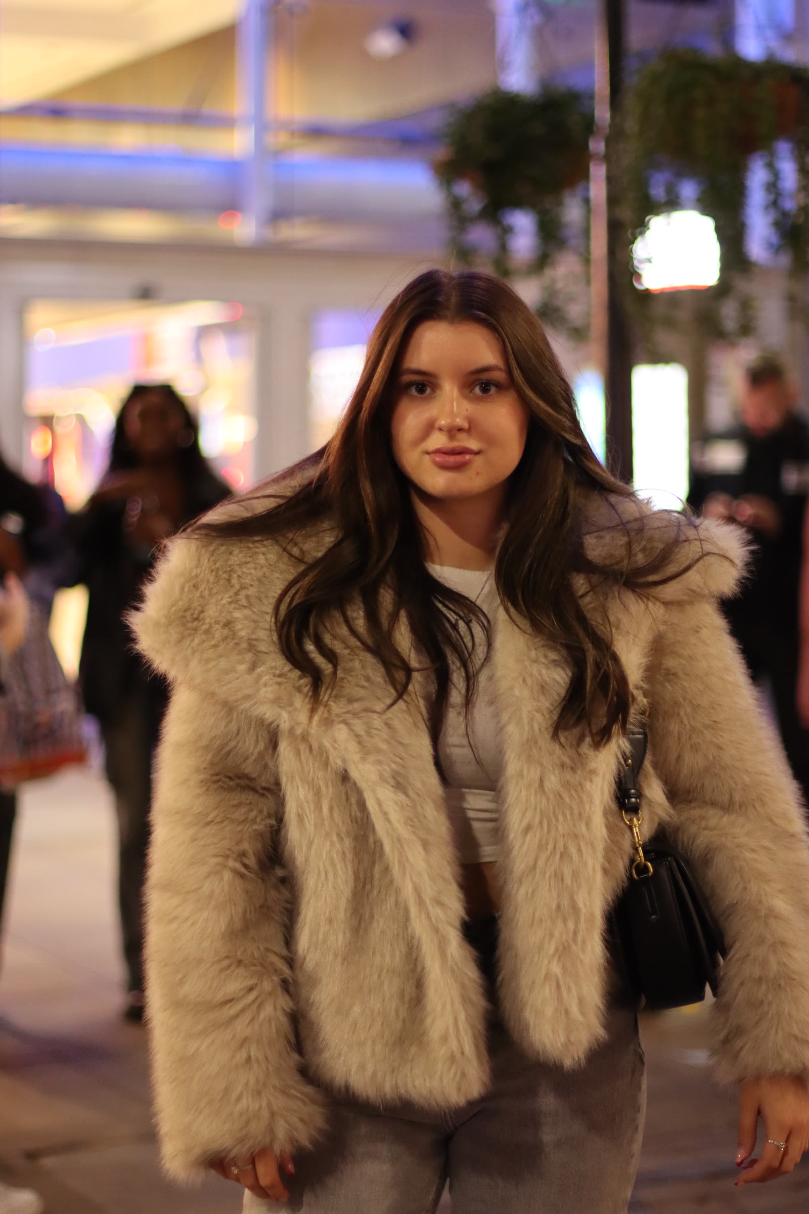 Strangers in the city: Faux fur and shop lights