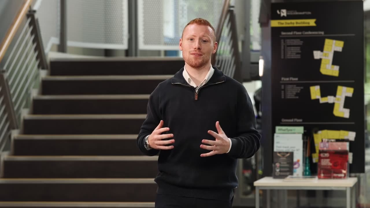 Joseph Carey presenting to camera