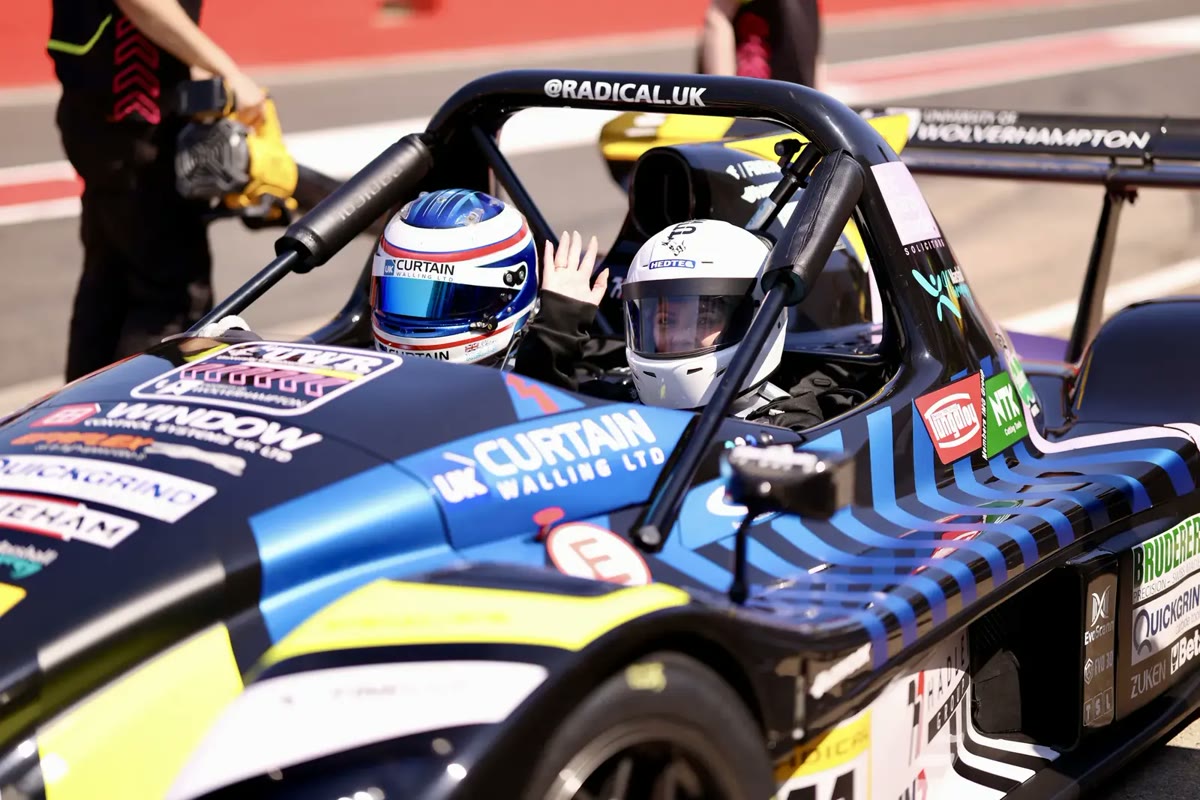 Strapped in: Two drivers in the Radical SR3 before a run